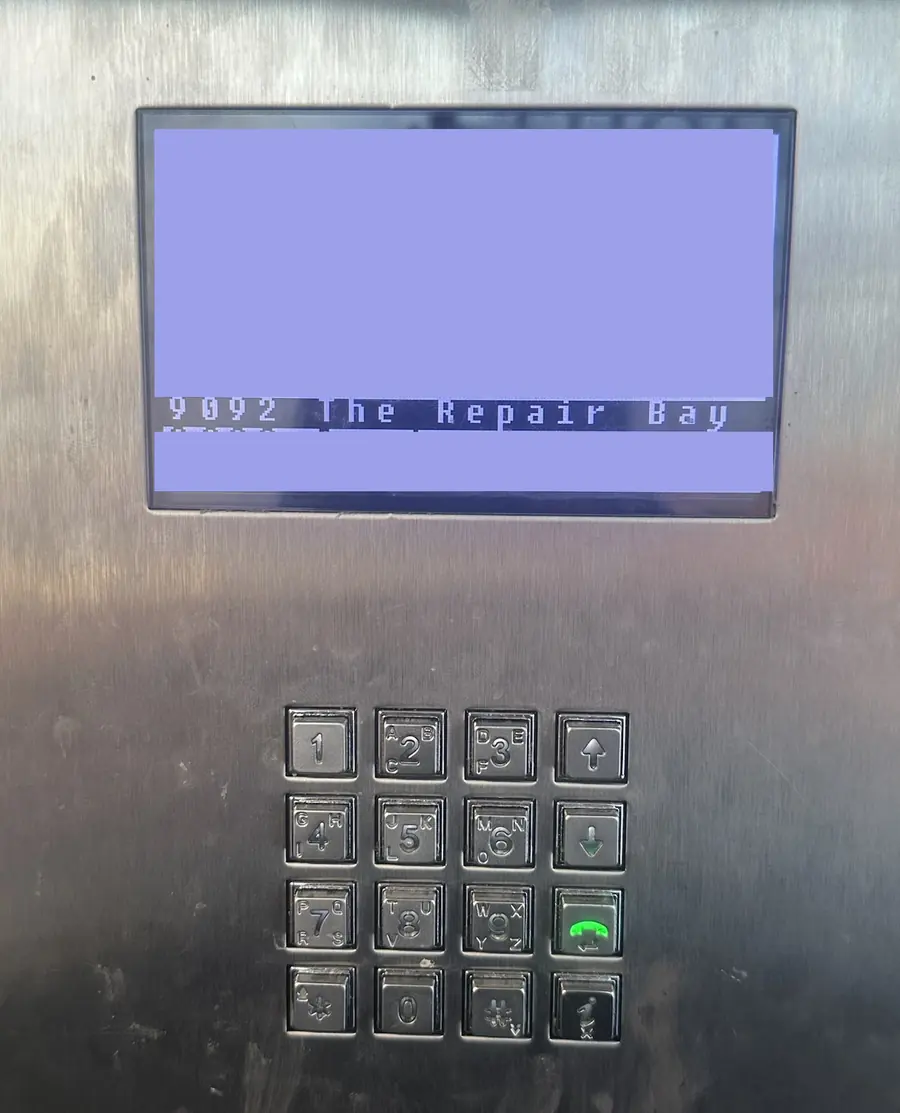 Close-up of the buzz panel screen showing 9092 The Repair Bay, above the number keypad.